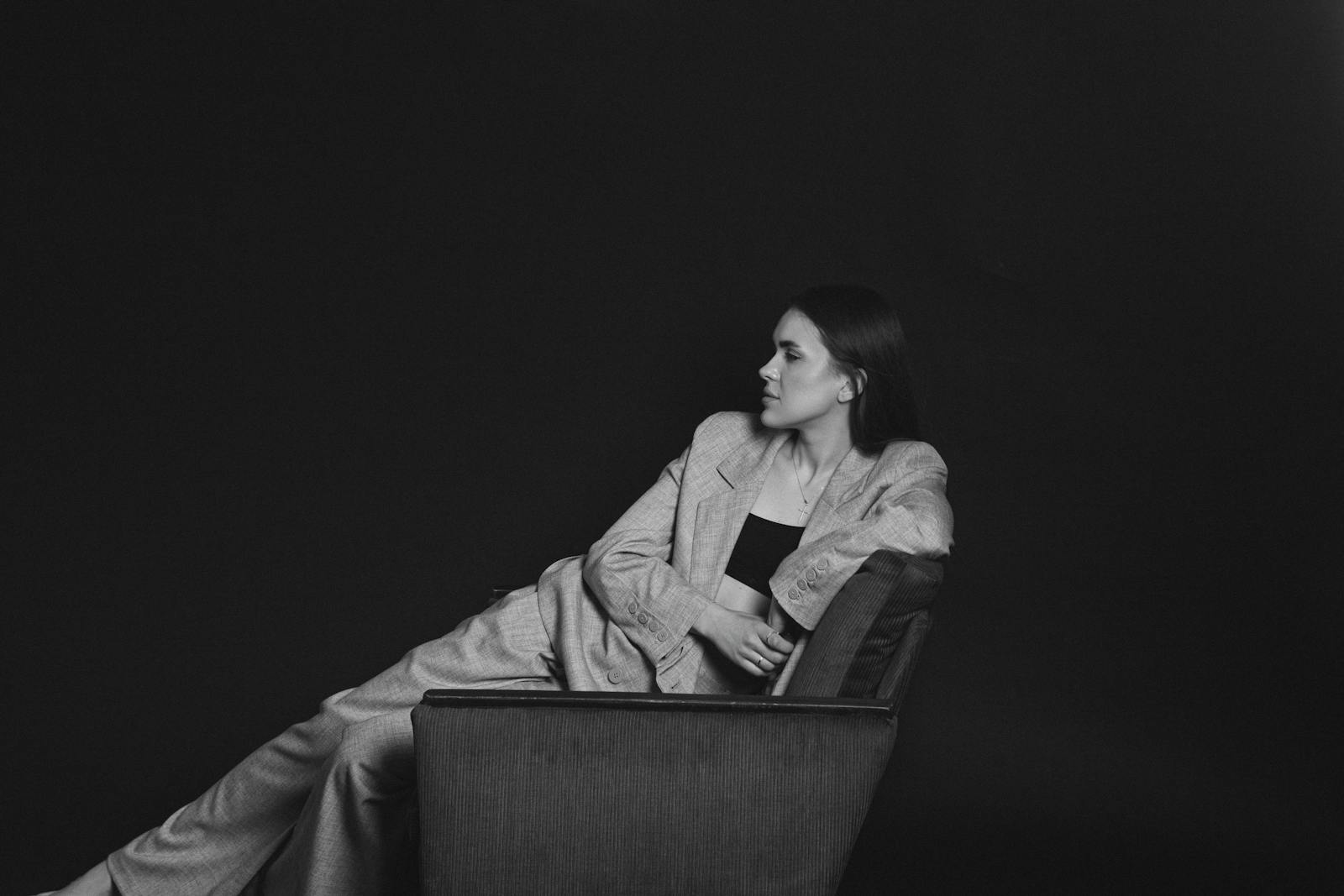 Portrait of a designer seated in a studio armchair